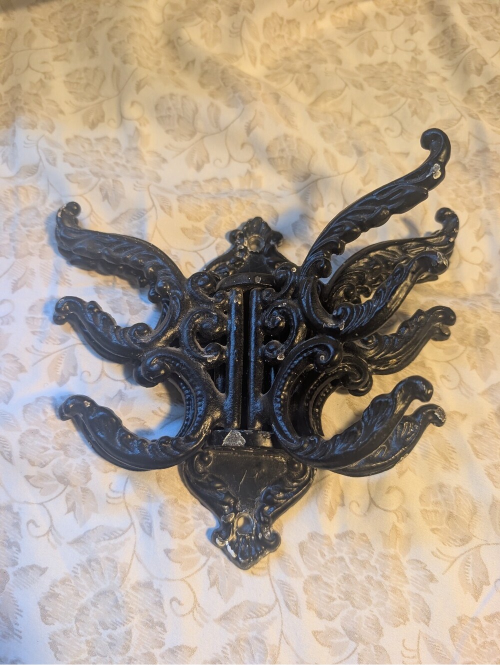 Vintage Black Cast Iron Wall-Mounted Coat Rack with Ornate Design